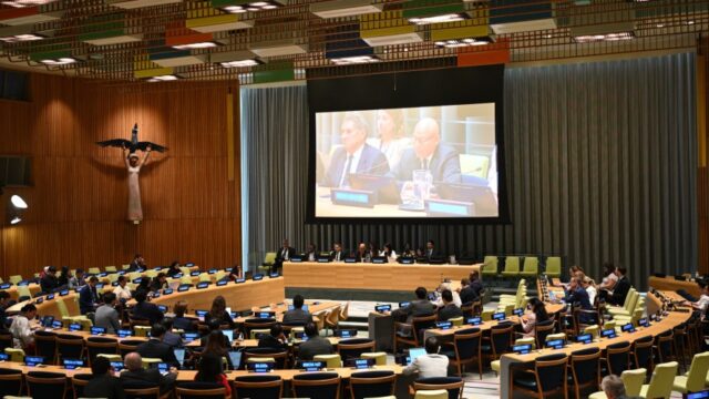 UN Climate Chief Says Faster Energy Transition Is Key to National Security